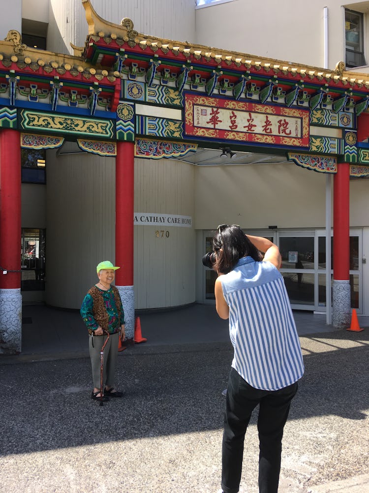 Photographer Andria Lo photographing a senior citizen for Chinatown Pretty in San Francisco