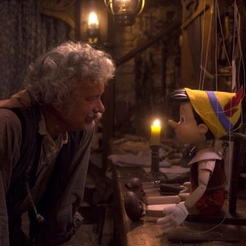 Tom Hanks as Geppetto in the live-action remake of Pinocchio. Here he looks at the wooden puppet bef...