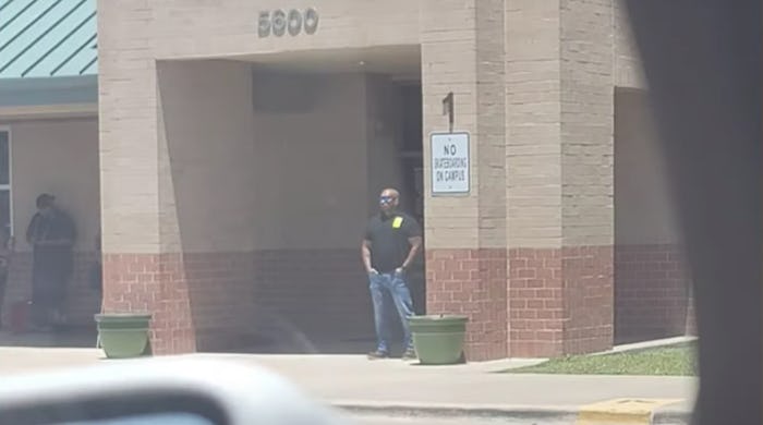 Texas dad protects wife and daughter outside Uvalde school.