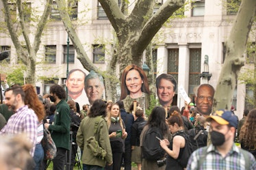 Protesters holding up signs of Supreme Court Justices at a pro-choice protest in Foley Square, New Y...
