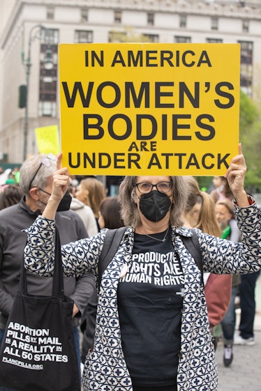 A person holding up a sign at a pro-choice protest at Foley Square in Manhattan