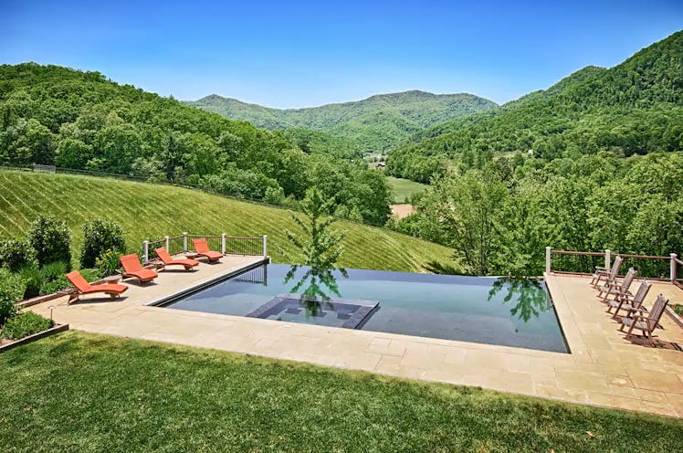 This North Carolina Airbnb with infinity pool also has an outdoor fireplace.