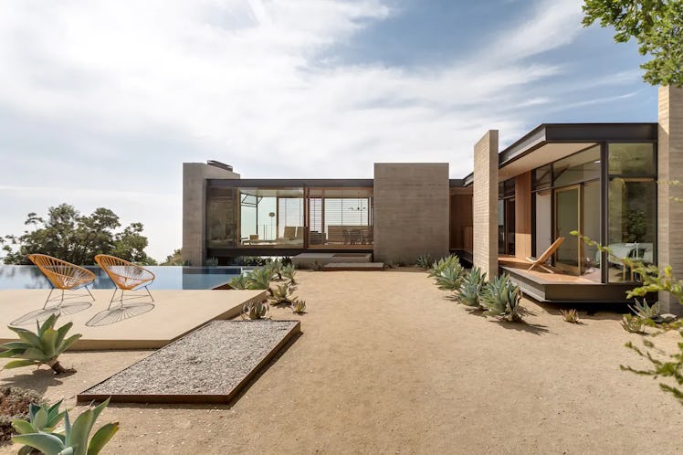 This mountain Airbnb with infinity pool has mountain and ocean views.