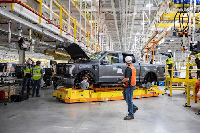 Workers at the Rogue Electric Vehicle Production Center
