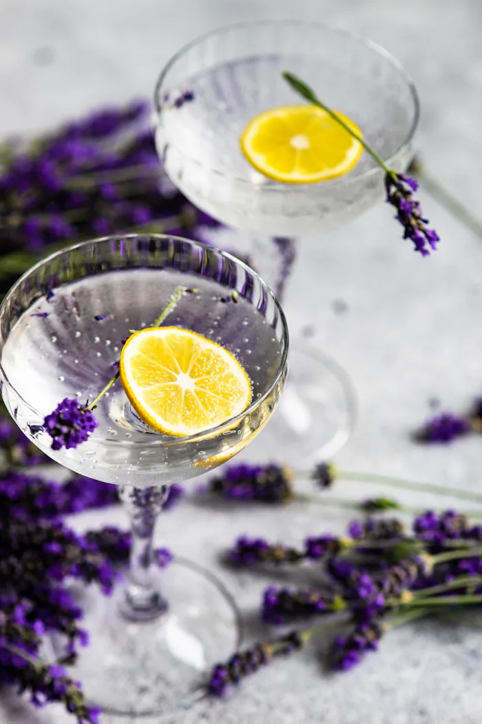 Mother's Day cocktail ideas; two glasses with lemons, flowers