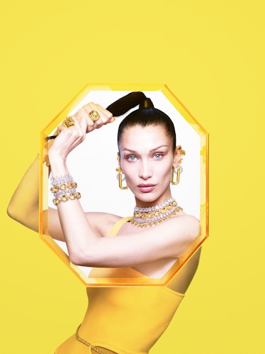 Bella Hadid pulling on her ponytail in a Swarovski campaign