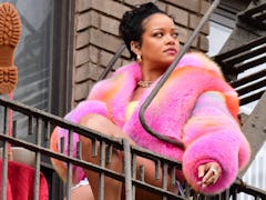 Rihanna in a fluffy pink coat, filming A$AP Rocky's "D.M.B." music video in NYC.