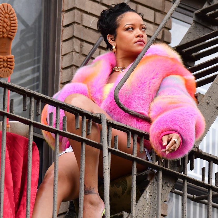 Rihanna in a fluffy pink coat, filming A$AP Rocky's "D.M.B." music video in NYC.