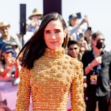 Jennifer Connelly smiling and wearing custom gold Louis Vuitton