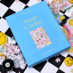 Blue box of a smart cookie 1000 piece puzzle as an essential for a self-care kit that helps with anx...