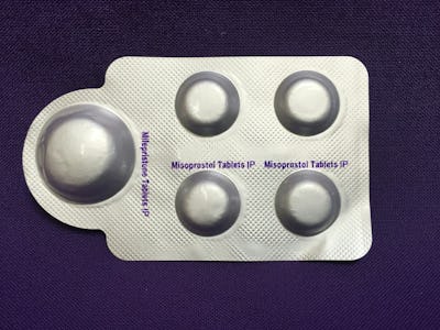 A combination pack of mifepristone (L) and misoprostol tablets, two medicines used together, also ca...