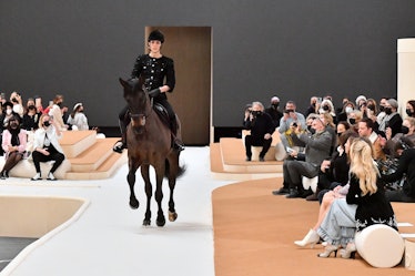 Charlotte Casiraghi riding a horse on the runway of a Chanel show