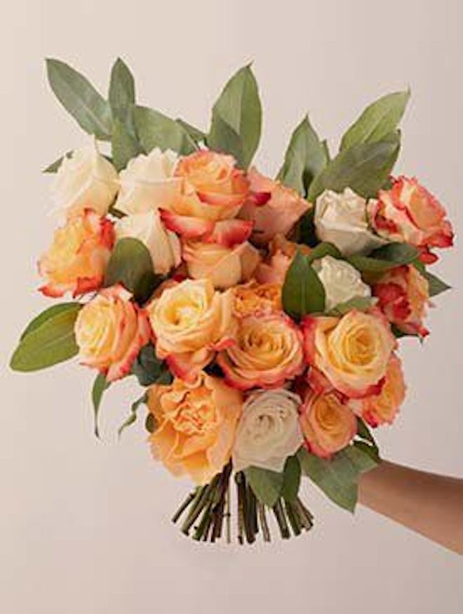 pretty white and orange rose bouquet is a great gift for stepmom