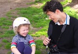 Julian Shapiro-Barnum talks to a child wearing a bicycle helmet on 'Recess Therapy.'