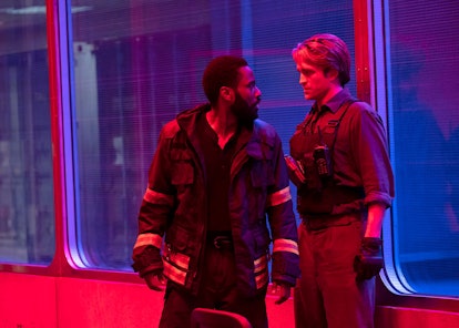 The “Protagonist” (John David Washington) and Neil (Robert Pattinson) inside of the turnstile in Ten...