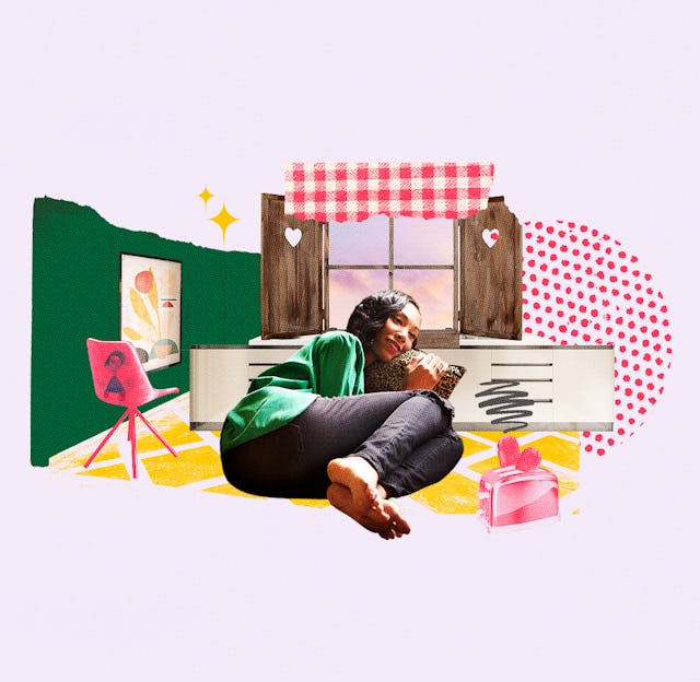 A woman wearing a green shirt and black pants while lying on a pillow next to a window