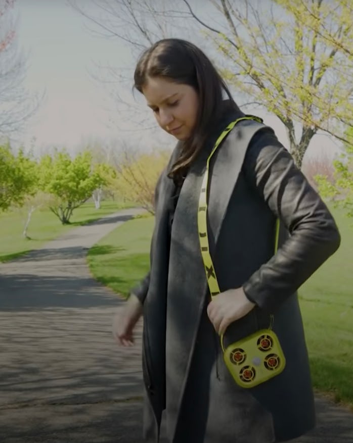 The Wall Street Journal’s Joanna Stern wearing the Pixy drone like a shoulder bag.
