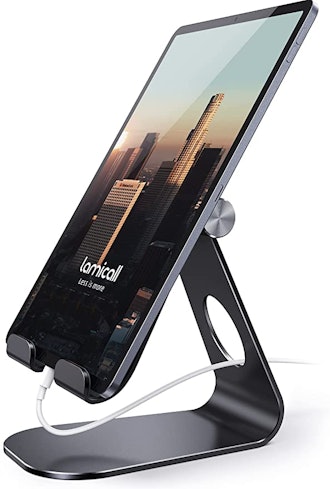 If you're looking for the best Kindle accessories, consider this tablet stand with a space for your ...