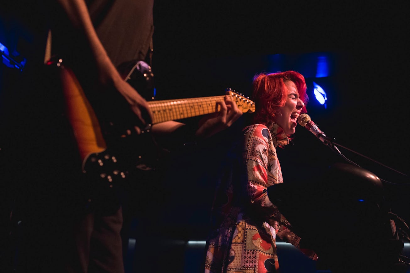 Female singer and pianist Sam Behr singing at NYC hot spot The Nines, a new piano bar and supper clu...