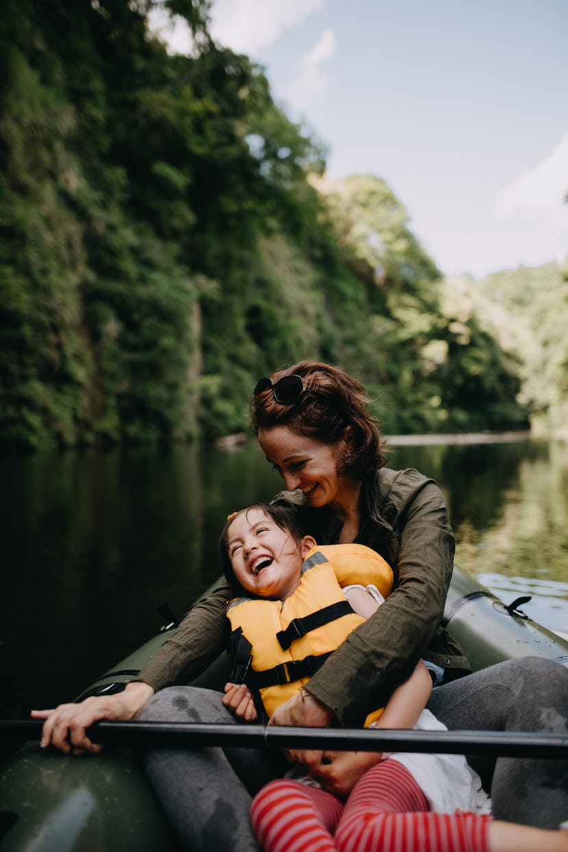 Last minute Memorial Day travel ideas; woman and kid in a kayak 