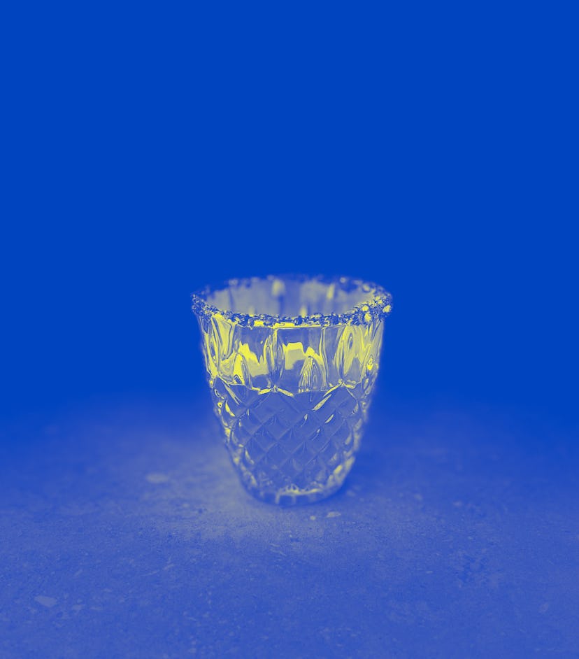 Flamin' Hot Mountain Dew martini in tumbler glass with Cheeto dust rim