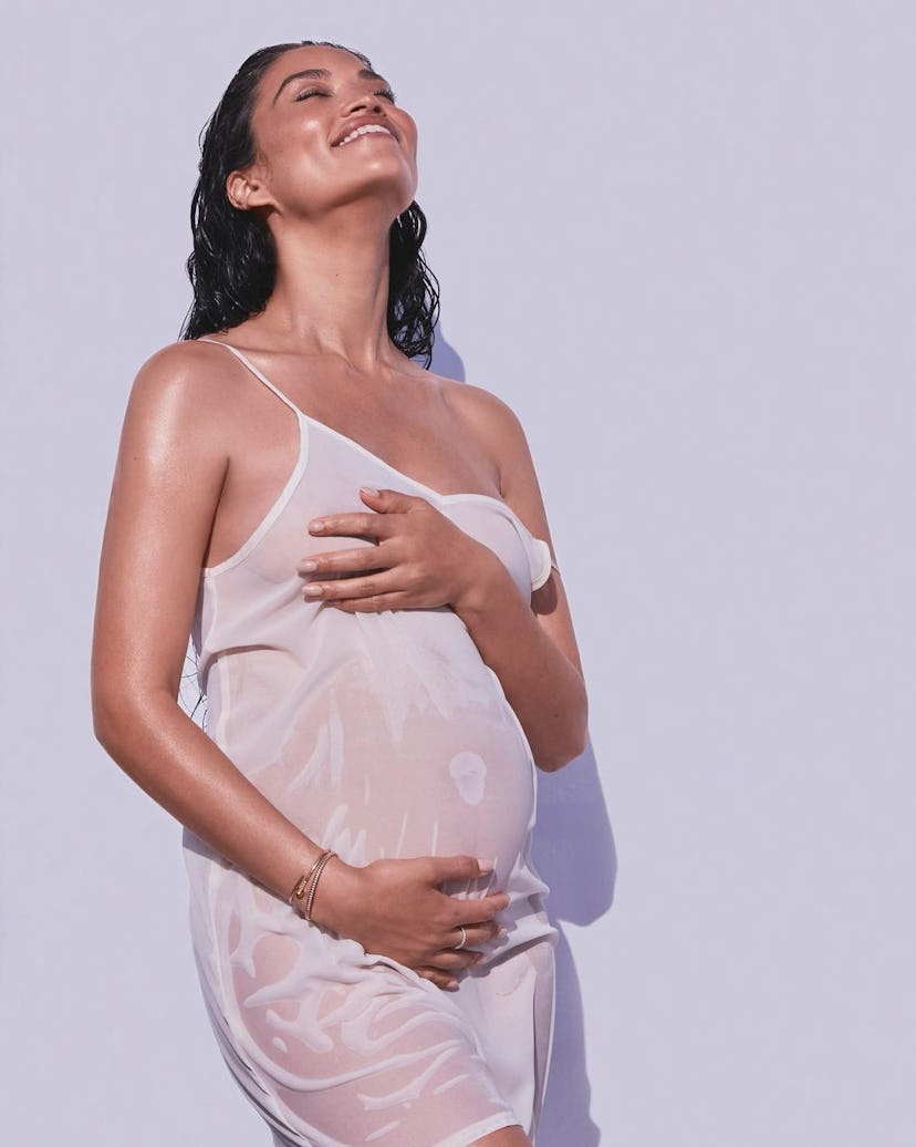 Shanina Shaik, pregnant in a white dress