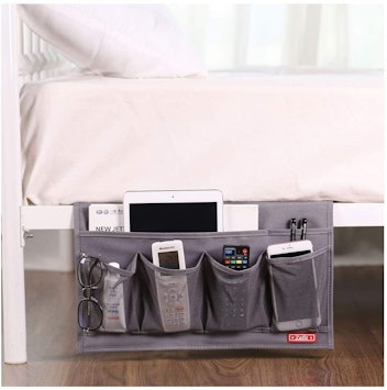 A bedside storage caddy keeps favorite items, like the remote control, handy.