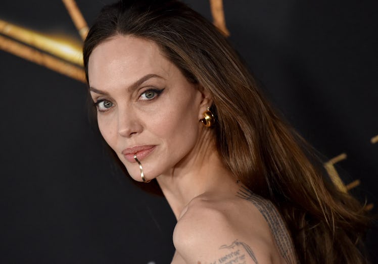 Angelina Jolie wearing jewelry on her chin