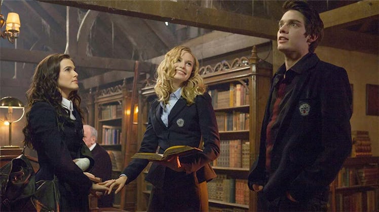 Rose Hathaway, Lissa Dragomir, and Christian Ozera at the St. Vladimir’s library in Vampire Academy.