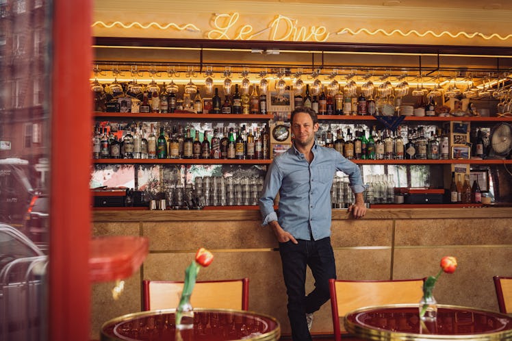 the restaurateur Jon Neidich standing at the bar of his new establishment Le Dive