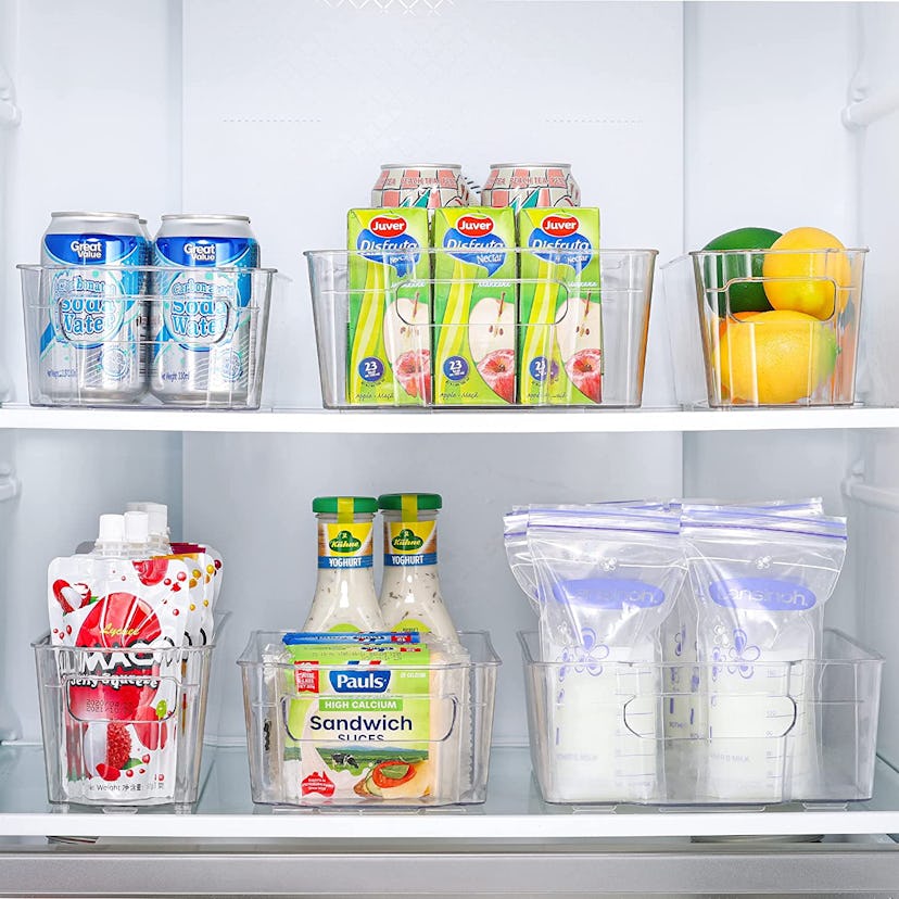 Organizing the fridge can be made easy with clear storage bins.