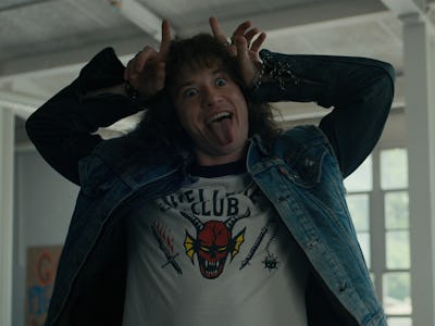 Eddie Munson (Joseph Quinn) from Stranger Things making a silly face while wearing a white Hellfire ...