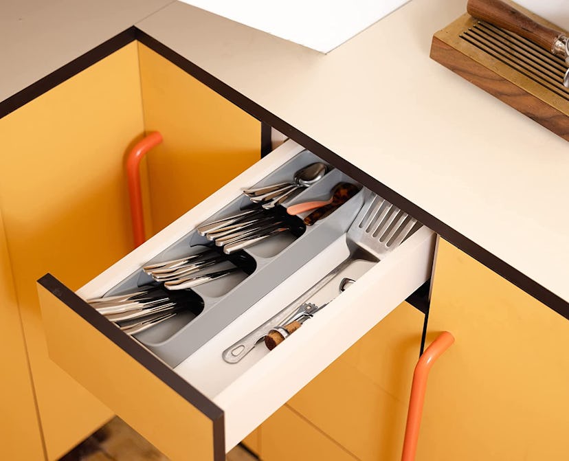 A compact cutlery organizer makes the most of drawer space.