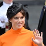 Princess Eugenie wearing orange and waving