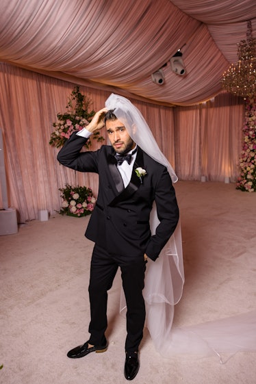 Sam Asghari wearing Britney Spears's veil at their wedding