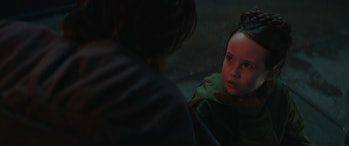 Leia Organa (Vivien Lyra Blair)  looking up at Ben Kenobi (Ewan McGregor) in Episode 2 of Obi-Wan Ke...