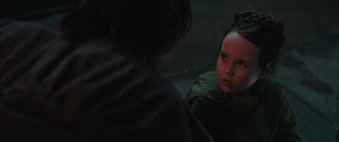 Leia Organa (Vivien Lyra Blair)  looking up at Ben Kenobi (Ewan McGregor) in Episode 2 of Obi-Wan Ke...