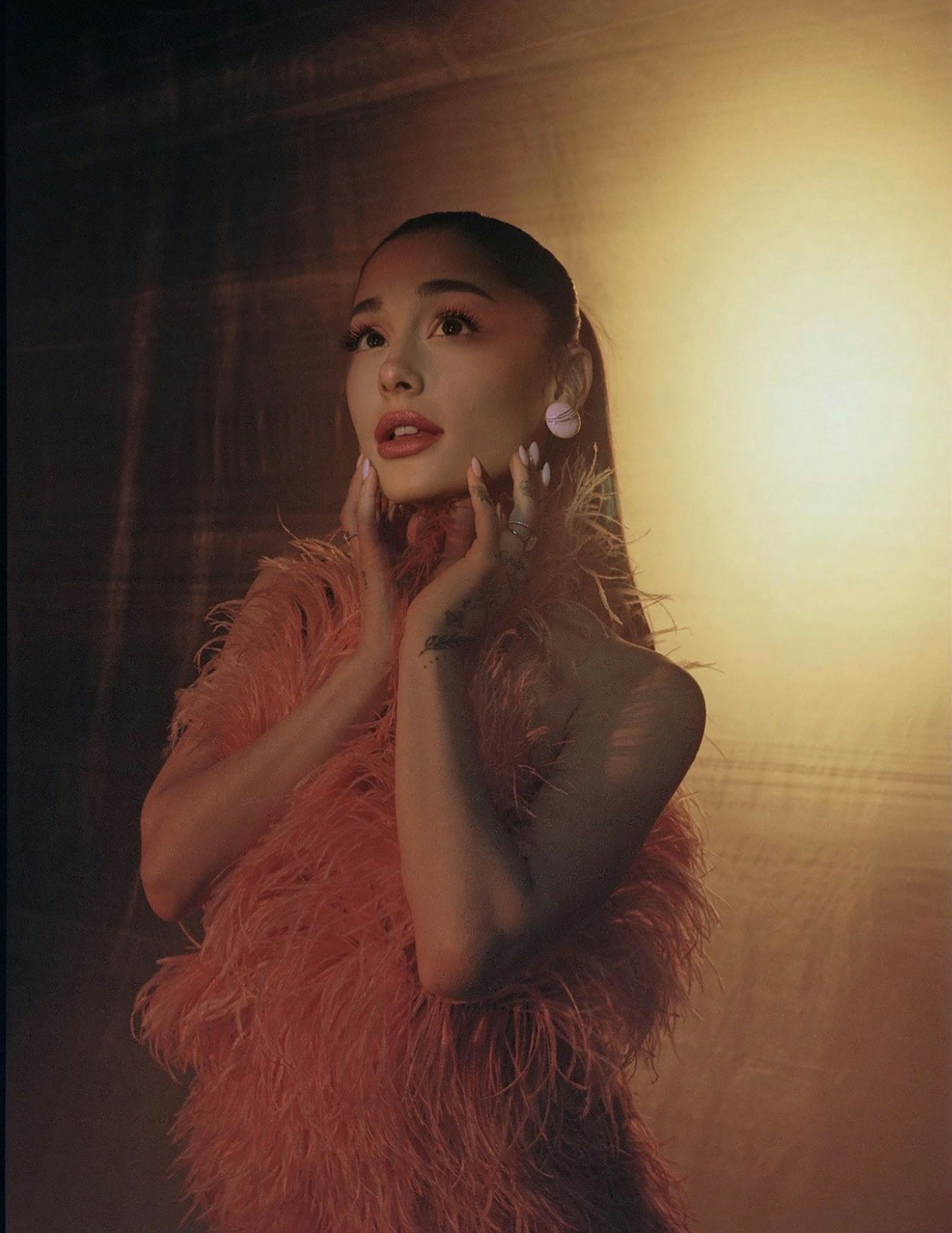 Ariana Grande wearing r.e.m. beauty chapter three lip products.