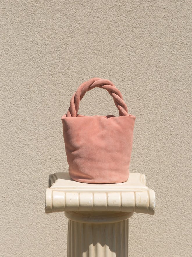 Yvonne Koné pastel pink suede bucket bag