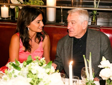 Penelope Cruz and Robert Deniro sitting and talking together at a restaurant booth at Balthazar in t...