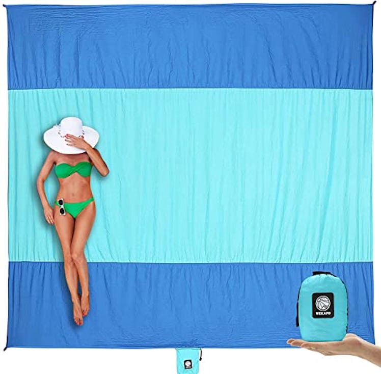 This beach towel is one of the weird but genius products to pack for your beach vacay. 