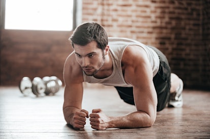 A man holds a plank ab workout.