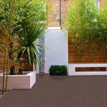 Easy-to-install deck tiles make creating a patio seating area a breeze.