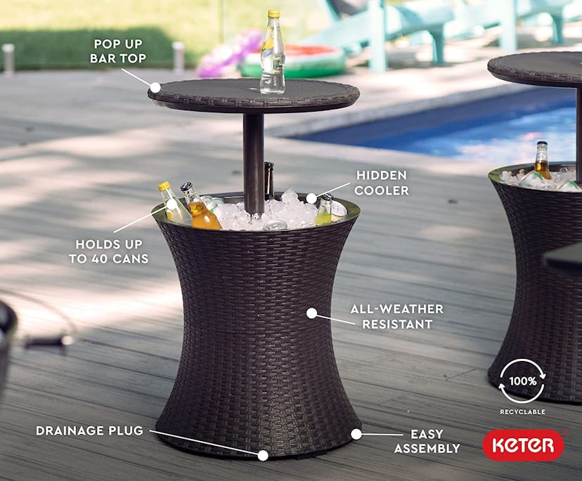 This backyard table pulls double duty as a bar table and cooler.