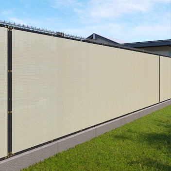 An oversized privacy screen can cover an unsightly fence and keep nosy neighbors at bay.