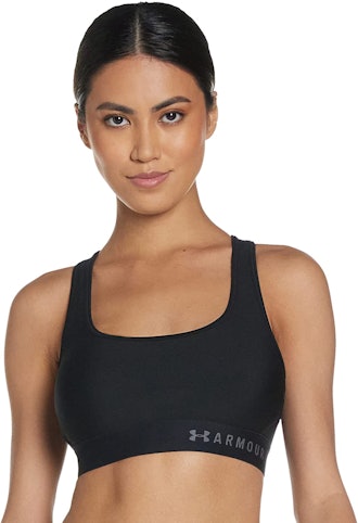 woman wearing Under Armour cross back sports bra