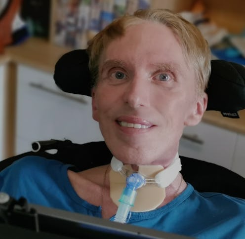 Dr Peter Scott-Morgan pictured in his wheelchair looking at the camera