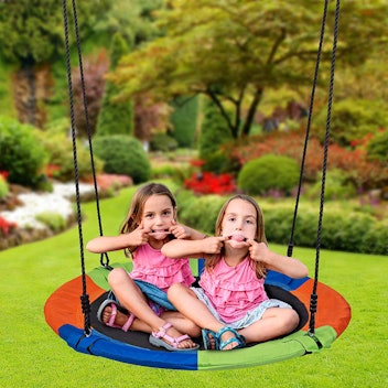 A saucer tree swing is big enough for multiple kids to enjoy.