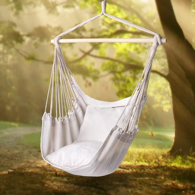 A hanging hammock chair lends boho style to the backyard.