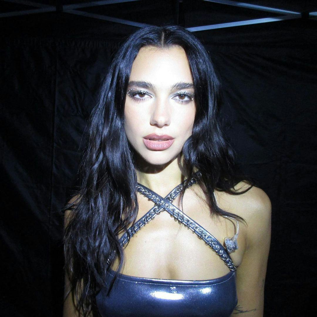 dua lipa wearing a silver bra top 